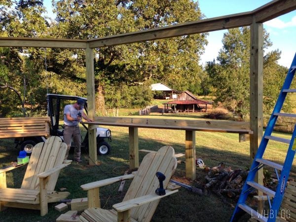 Building a Pergola with a Bar and Adirondack Chairs by Little White House Blog featured on @Remodelaholic