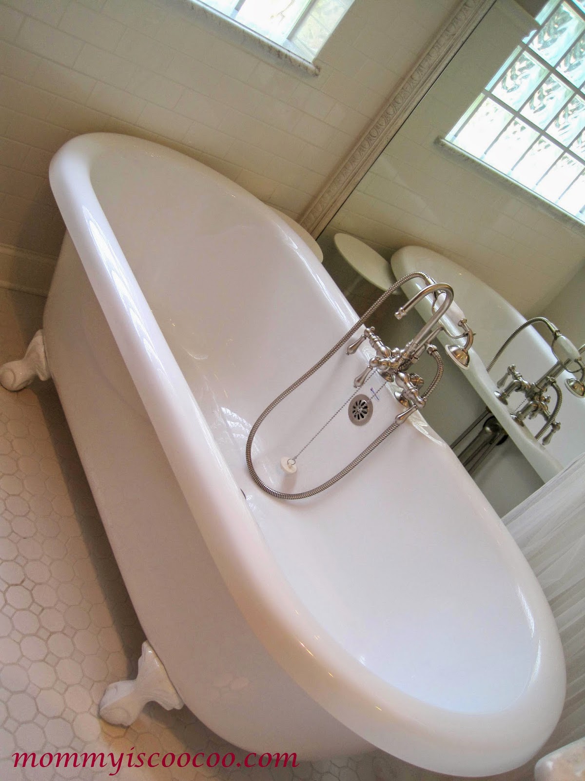 cast iron tub with mirror behind, Mommy is Coocoo on Remodelaholic