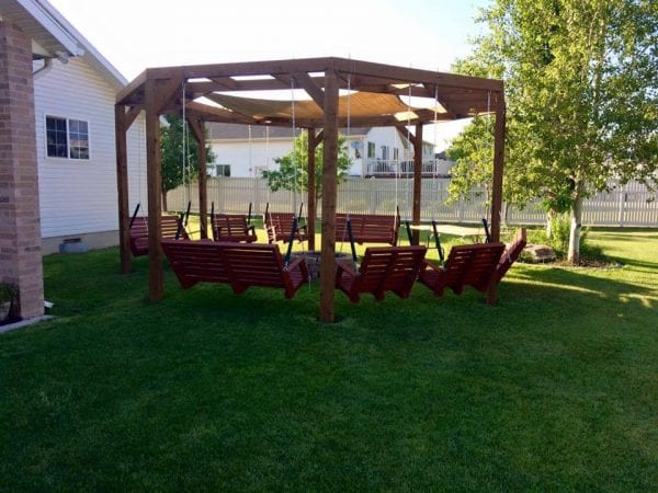 DIY round pergola with firepit and shade screen featured on @Remodelaholic