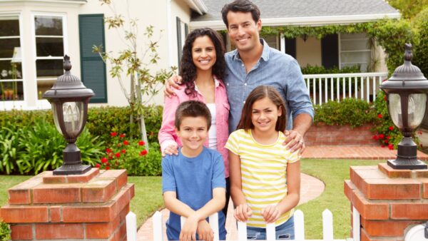 Happy Family Infront Of House