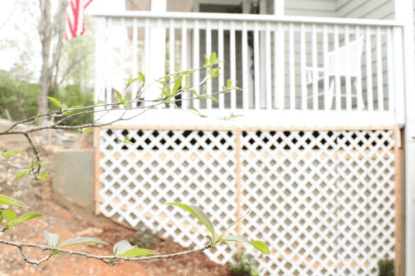 How To Install A Wood Trellis For Roses And Flowers Along A Concrete Porch Foundation Wall, Top Shelf DIY On Remodelaholic