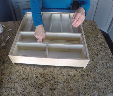 Insert dividers and tension will hold them into place in this organizer