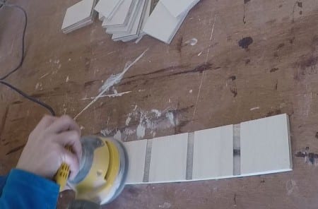 Remodelaholic Removable Utensil Drawer Organizer Step 5c sanding down organizers for a smooth finish.