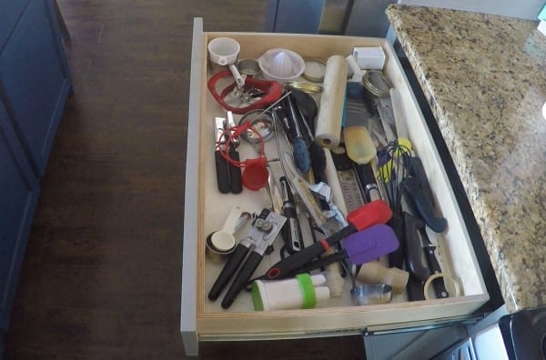 Messy drawers be gone. A simple no nails or glue solution with a utensil drawer organizer featured on Remodelaholic.com