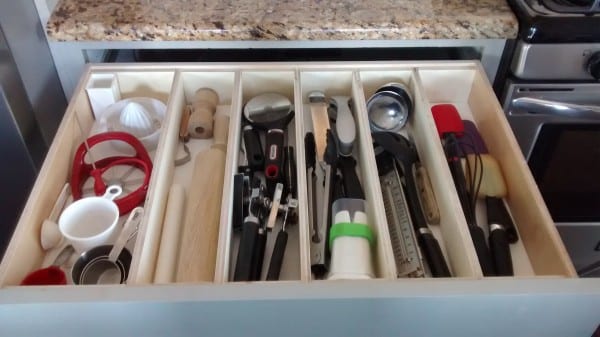 Organize large utensils with drawer dividers made of plywood featured on Remodelaholic.com